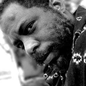 Black and white portrait photograph of artist Andres Montalvan Cuellar.