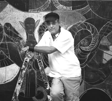 Black and white photograph of a man resting on a step ladder and looking at the camera.